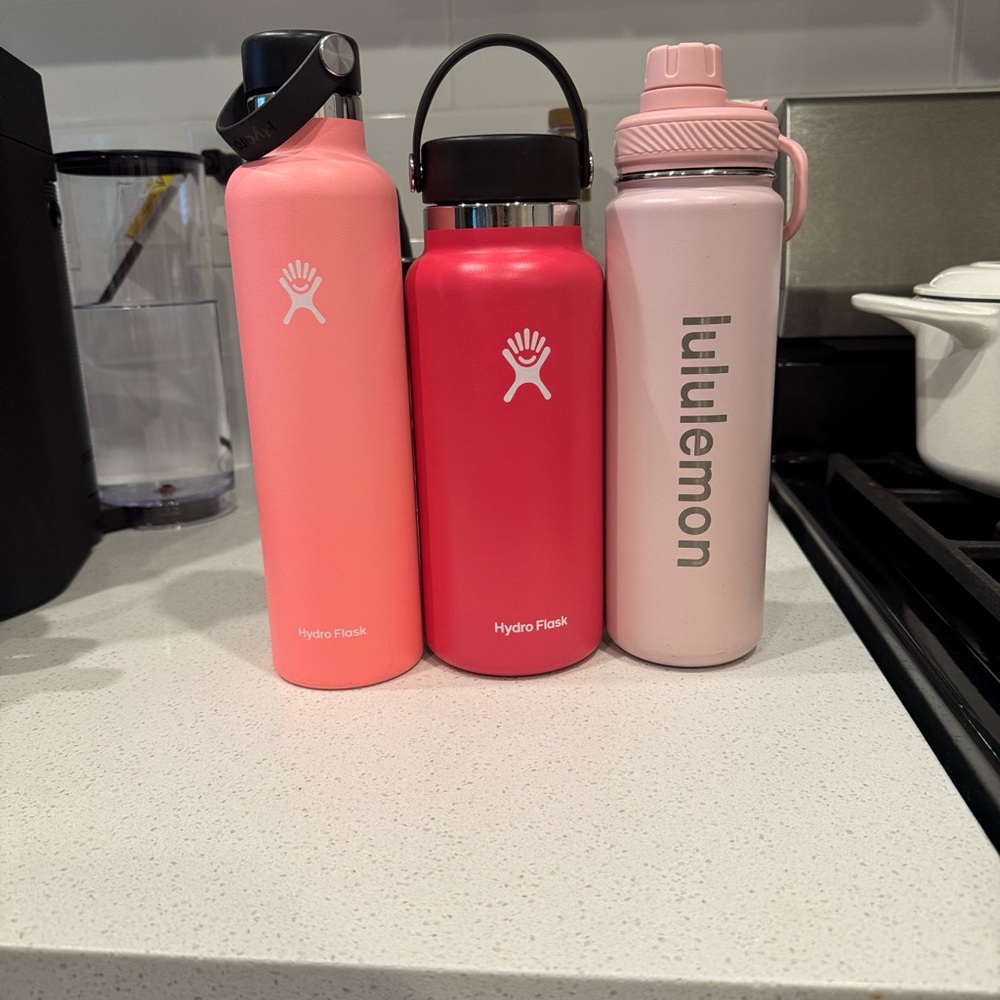 2 hydroflask and 1 lululemon insulated water bottle